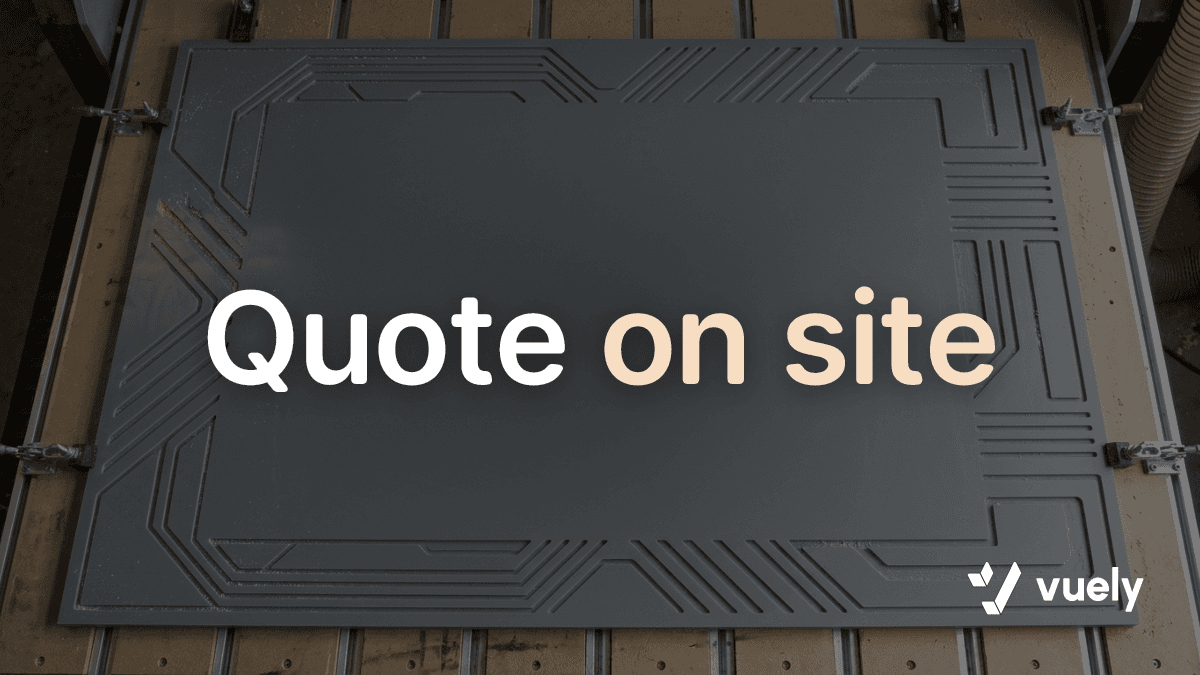 Quote on site. Overhead view of a CNC router table with newly cut geometric shapes in gray acrylic and an uncut open center.