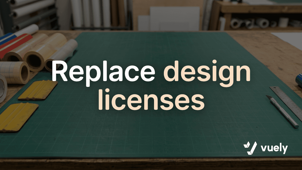 Replace design licenses. A clean sign shop workbench with a green cutting mat in the center and vinyl application tools resting along the edges.