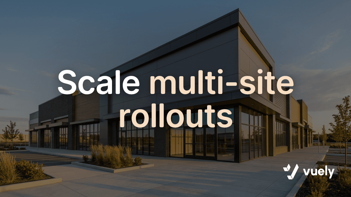 Scale multi-site rollouts. A clean modern commercial storefront facade bathed in warm afternoon sunlight awaits a new sign installation.