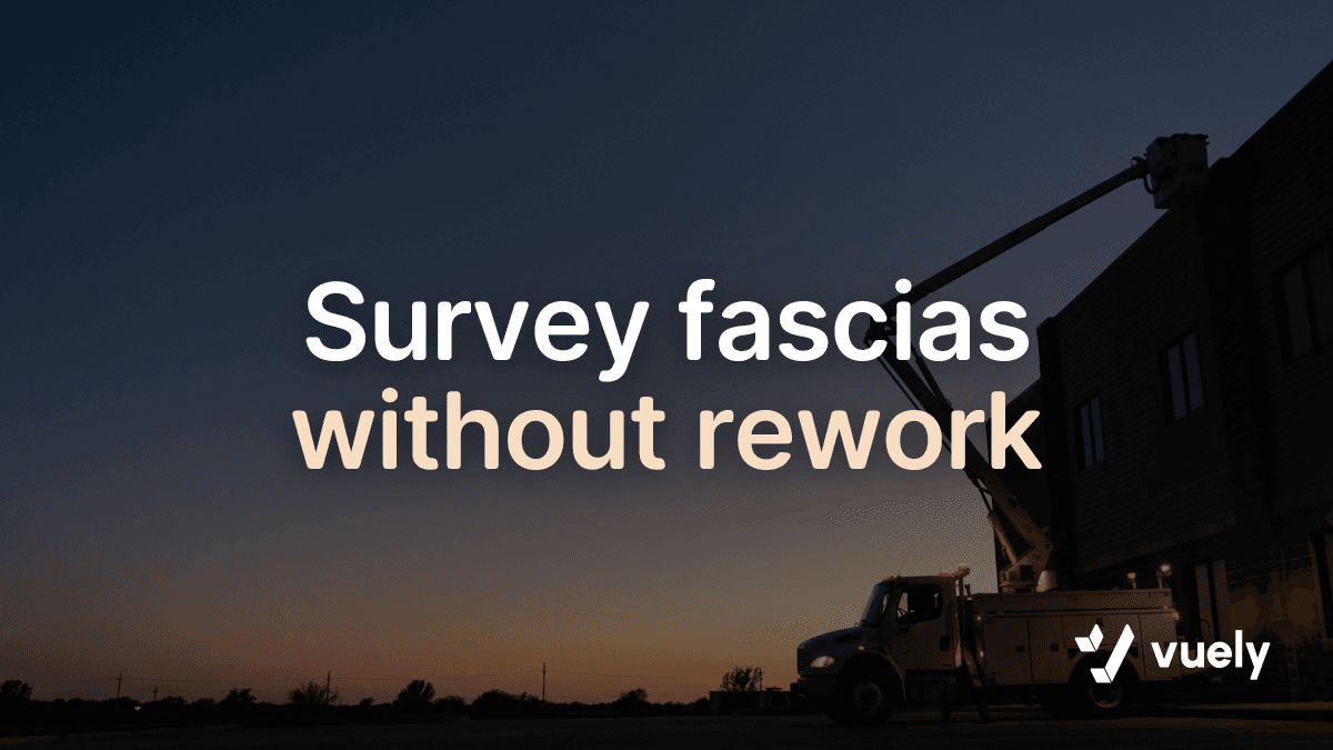 Survey fascias without rework. A service bucket truck with its boom raised against a twilight sky near a commercial storefront.